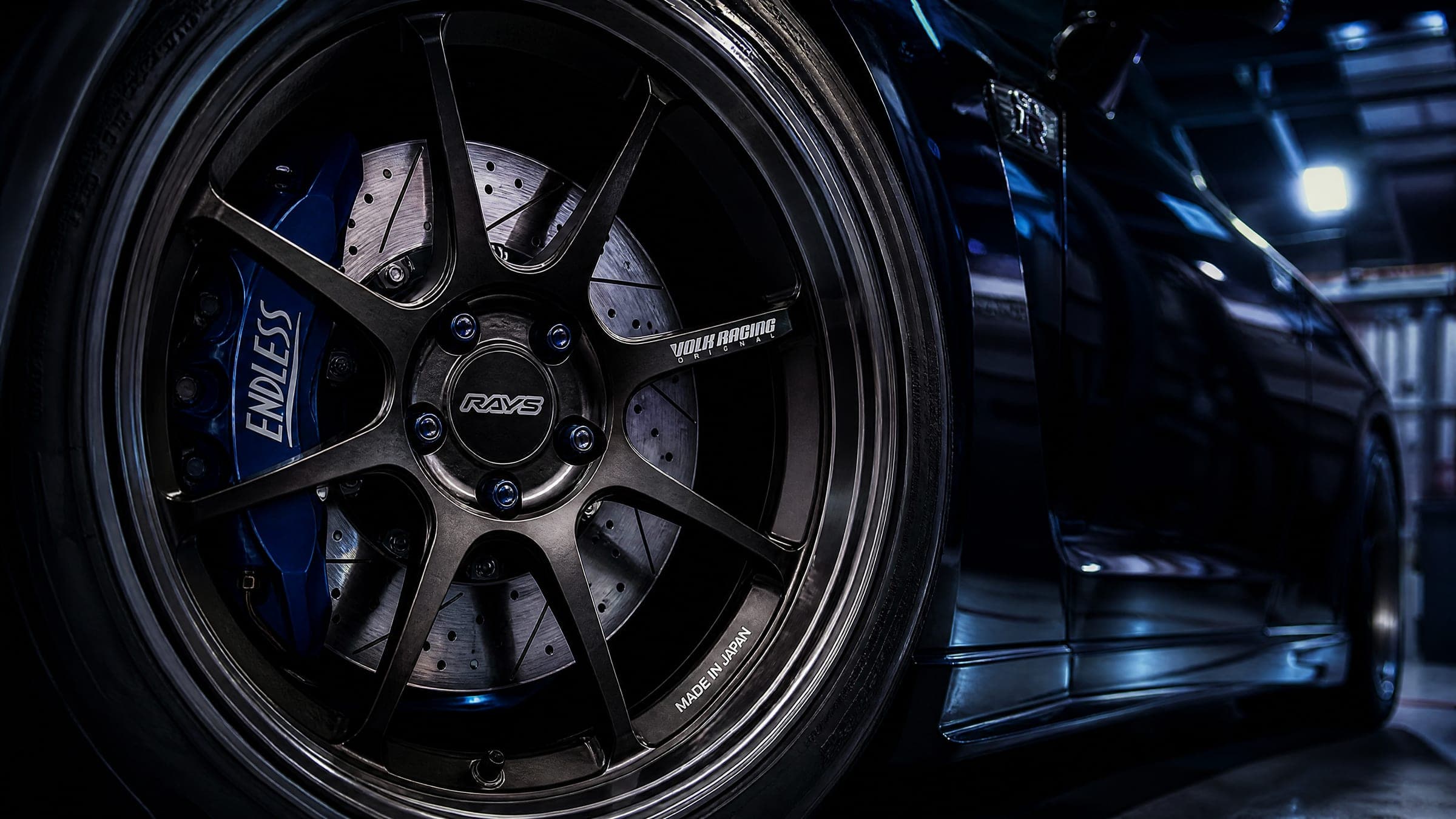 Close-up of a brake caliper and performance alloy wheel